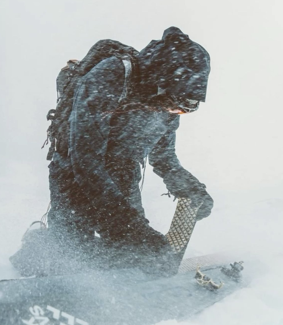 Skier buried in snow after an alpine fall — the six-to-fifteen-minute survival window AERIS is designed for.